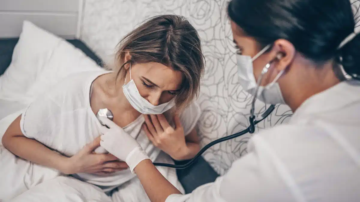 Woman having breathing monitored by a doctor. Text explains the importance of medical supervision during detox.