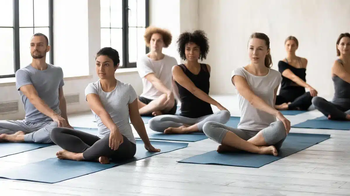 Three images of people meditating and practicing yoga. Text explains the value of mind-body techniques in therapy.